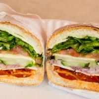 Veggie Delight Sandwich · Muenster cheese, lettuce, tomato, onions, cucumbers, sun-dried tomato and roasted peppers.