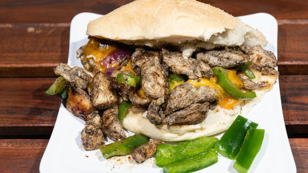 Jerk Chicken Philly · Deliciously grilled jerk chicken on a hero bun, with your choice of mayo, lettuce, sautéed green peppers, onions and two slices of your choice of cheese