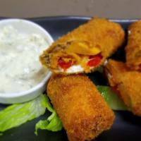 Goat Cheese Egg Roll · An Enticing Blend Of Goat Cheese, Pesto, Roasted Sweet Potato, Red Peppers, Walnuts, Sweet S...