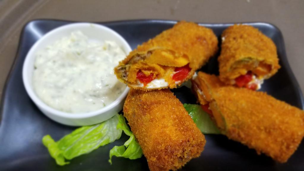 Goat Cheese Egg Roll · An Enticing Blend Of Goat Cheese, Pesto, Roasted Sweet Potato, Red Peppers, Walnuts, Sweet Sauce, And Two House Dipping Sauce.