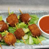 Mozzarella Sticks · Crispy Deliciously-Seasoned Mozzarella Cheese, Fried to Perfection. Served With Our House Ma...