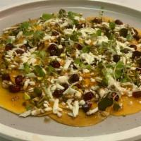 Pumpkin Carpaccio · Thinly Sliced Butternut Squash With Crushed Pistachios, Shredded Feta Cheese, Pomegranate Se...