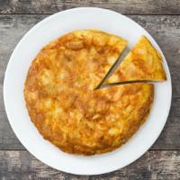 Spanish Omelette · Fluffy scrambled eggs mixed with onion, jalapeño, cilantro, pepper, and jack cheese. This pl...