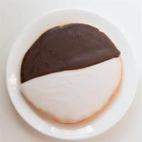 Black & White Cookies · Cookies dipped in vanilla and chocolate frosting.