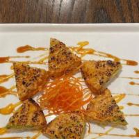 Sushi Pizza · Fried rice topped with your choice of seared spicy tuna, or spicy salmon, with avocado, and ...