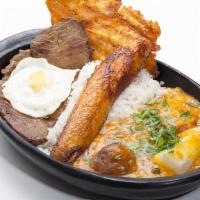 Grilled Steak With Creole Sauce · Grilled steak, fried egg, fried sweet plantain, fried green plantain, cassava, and potatoes ...