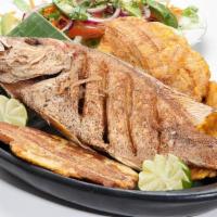Fried Red Snapper · Served with rice and salad.