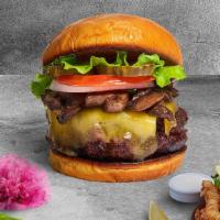 Mushroom Melts Vegan Burger · Seasoned Impossible burger patty topped with vegan cheese, mushrooms, caramelized onions, an...
