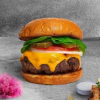 Cheesy Mood Vegan Burger · Seasoned Impossible burger patty topped with melted vegan cheese, lettuce, tomato, onion, an...