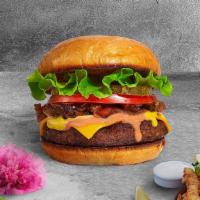 Classic Bliss Vegan Burger · Seasoned Impossible burger patty topped with lettuce, tomato, vegan mayo, and pickles. Serve...