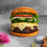 Penny For Peno Vegan Burger · Seasoned Impossible burger patty topped with melted vegan cheese, jalapenos, lettuce, tomato...