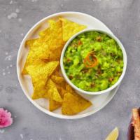 Guacamole & Chips · A heaping scoop of fresh guacamole and fresh fried tri-colored corn tortilla chips.