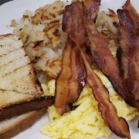 Two Eggs Scrambled W/ Am Cheese · Two Eggs any style cooked to your liking. served with home fries, and choice of toast