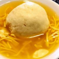 Matzoh Ball W/ Noodles Large (24Oz) · Our Homemade Matzoh ball soup with noodles.