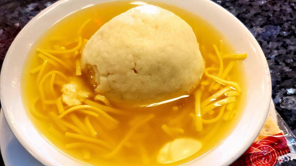 Matzoh Ball W/ Noodles Large (24Oz) · Our Homemade Matzoh ball soup with noodles.