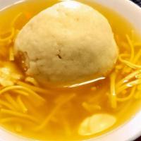 Matzoh Ball W/ Noodles (16Oz) · Our Homemade Matzoh ball soup with noodles.