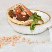 Falafel Pocket · Hummus, falafel, tahini, cucumbers, tomatoes, red onions, parsley