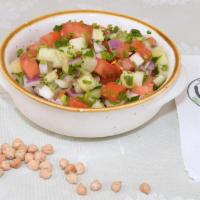 Chopped Salad · cucumbers, tomatoes, red onion, mixed nuts, freshly squeezed lemon, olive oil, parsley