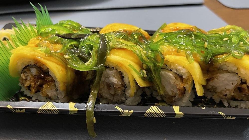 Ayame Roll · King crab, mango, avocado, cucumber, spring mix and masago wrapped in rice paper and chili yuzu sauce. No rice.