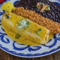 Chimichanga · Stuffed with beef or chicken, cheese, black beans, and pico de gallo and smothered with ques...
