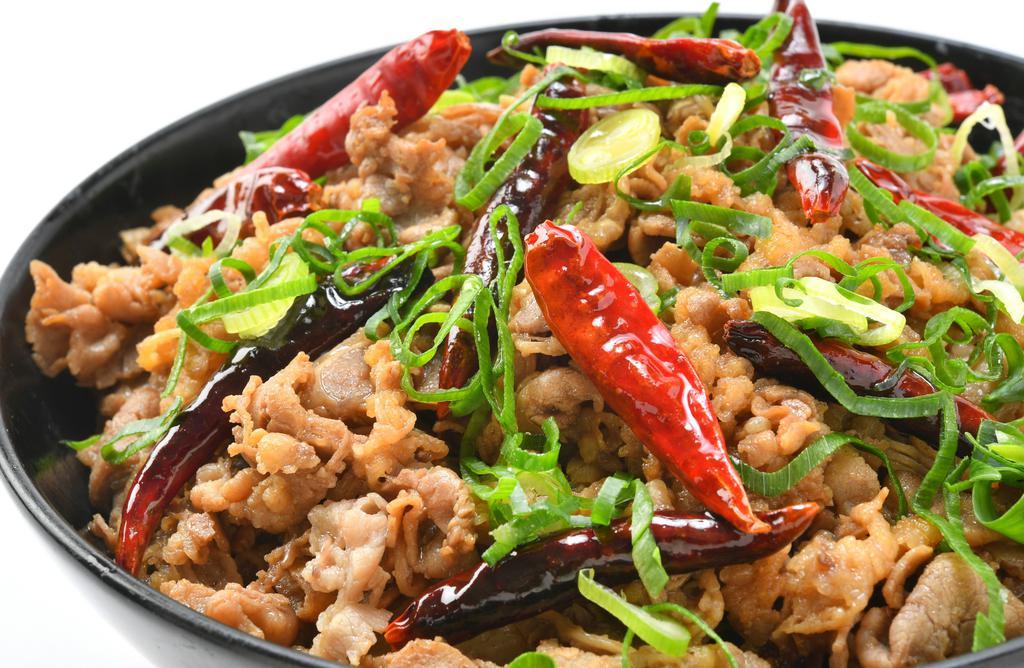 Devil Beef Bowl · This item consists of our shredded beef mixed with whole chili peppers and onions sauteed in our spicy sauce over a bed of rice topped with green onions.