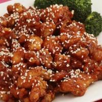 Sesame Chicken · Fried tender chicken served with broccoli in sesame sauce. Served with white or brown rice.