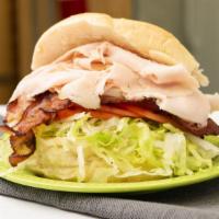 Classic Turkey Club · Roast turkey, bacon/ lettuce, tomato and mayo on a toasted hero.