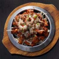 Spicy Chicken · Mild, medium, or hot.  Street style chili chicken tossed in a spicy glaze and topped with me...