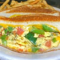 Breakfast Grilled Cheese · Breakfast grilled cheese with scrambled eggs, tomatoes, onions and peppers on white bread se...