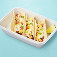 Queso Tacos · Order of 3 tacos. Pulled chicken, queso, spiced black beans, salsa fresca, corn, aged chedda...