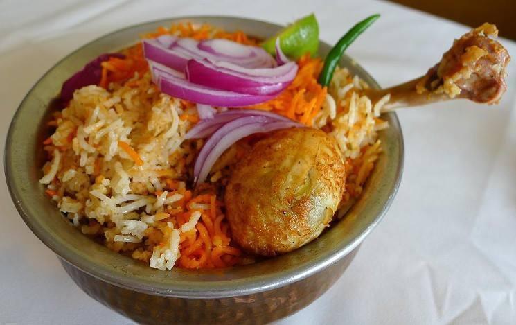 Natukodi Biryani · Country chicken cooked in basmati rice with special herbs and spices.