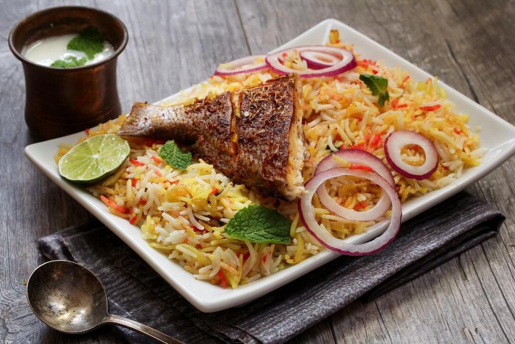 Fish Biryani · Fish cooked in basmati rice with special herbs and spices.