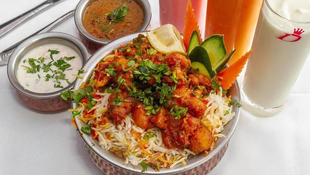Gobi Manchurian Biryani · Marinated fresh cauliflower florets and layered cooked with special secret spices and basmati rice.