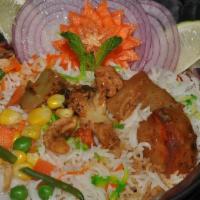 Vegetable Dum Biryani · Mixed vegetables cooked in basmati rice with special herbs and spices.