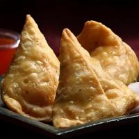Samosa · Home style pastry filled with potatoes and spices.