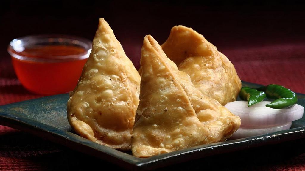 Samosa · Home style pastry filled with potatoes and spices.