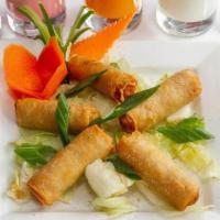 Vegetable Spring Rolls · A blend of fresh cabbage, carrots, and onions with a hint of seasoning, wrapped in a delicio...