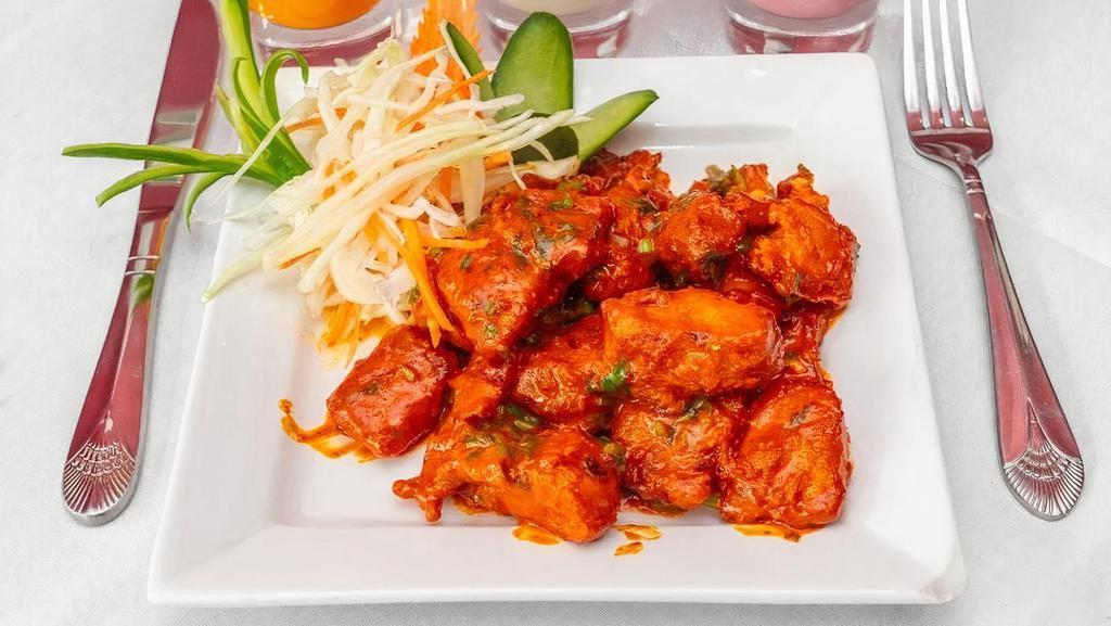 Apollo Fish · Slices of fish cooked with traditional Hyderabadi spices.