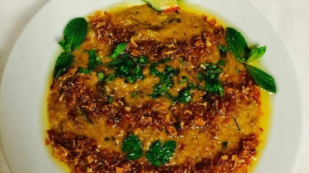 Goat Haleem · Slow cooked for seven to eight hours, which results in a paste-like consistency, blending the flavors of lentils, spices, mutton, barley and wheat.