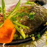 Pomfret Fish (Chef Special) · Chef special. Fish marinated with tandoor spices and then grilled in a tandoori.