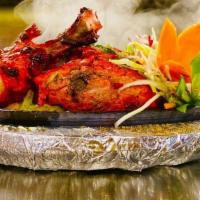 Tandoori Chicken · Chicken marinated in chef's special spices and cooked in tandoor.