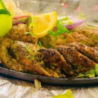 Chicken Seekh Kabab · Minced chicken cooked on skewers with spices.