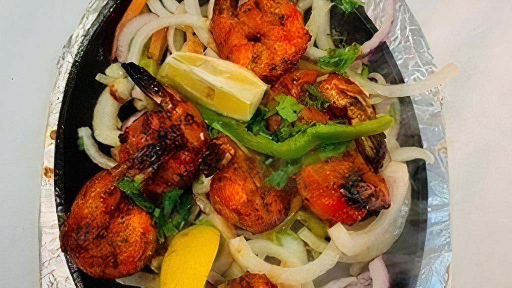 Tandoori Shrimp · Tiger prawn marinated in yogurt, Indian spices and cooked in tandoor.