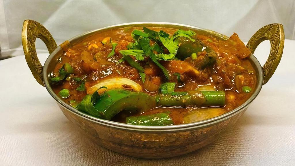 Chettinad Vegetable Curry · Flavorful and spicy curry prepared using vegetables, coconut and special spices. Rice will NOT be served with Entrees.