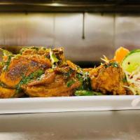 Natu Kodi Vepudu (Dry) · Desi chicken marinated with native spices and cooked with green chili and curry leaves. Rice...