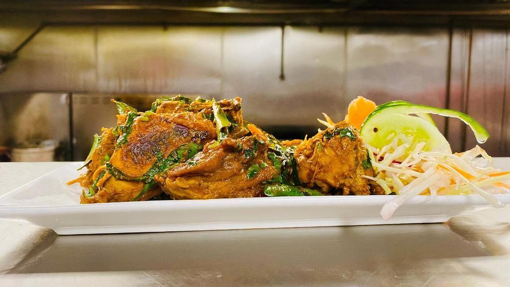 Natu Kodi Vepudu (Dry) · Desi chicken marinated with native spices and cooked with green chili and curry leaves. Rice will NOT be served with Entrees.