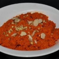 Gajar Ka Halwa · World famous dessert delicacy made with carrot, milk, dried fruit and nuts.