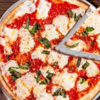 Margherita · A traditional Neapolitan pizza with homemade fresh mozzarella, fresh tomato and basil sauce,...