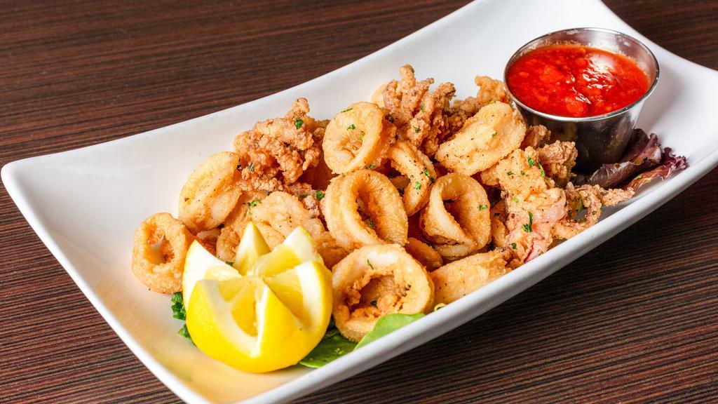 Calamari Fritti · Golden fried calamari served with a side of homemade marinara sauce or fra diavolo sauce.