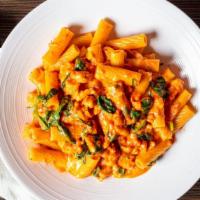 Rigatoni Fiorentina · Fresh chicken pieces, spinach and mozzarella cheese tossed in a creamy pink sauce over rigat...